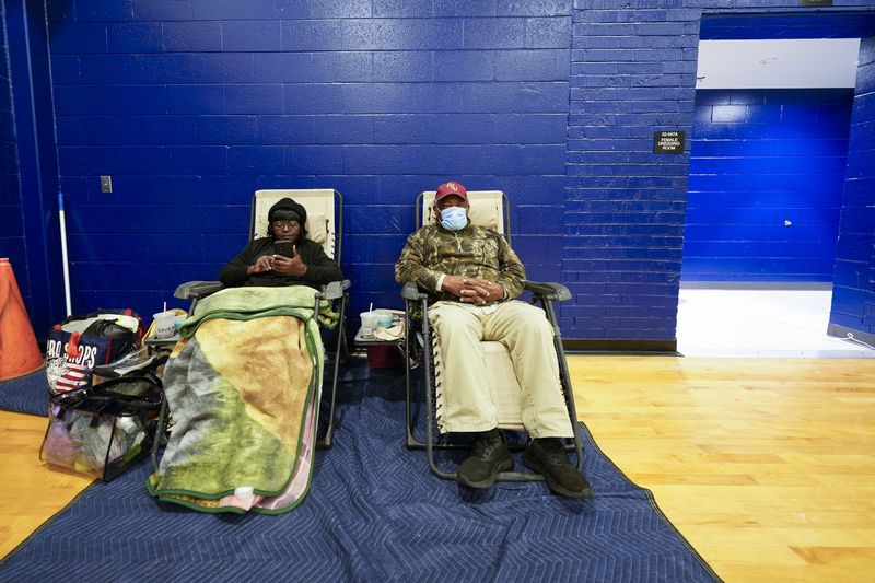 Mary Tanner Jerome Tanner, of Tallahassee, sit inside an evacuation shelter ahead of Hurricane Helene, expected to make landfall here today, in Leon County, Fla., Thursday, Sept. 26, 2024. (AP Photo/Gerald Herbert)