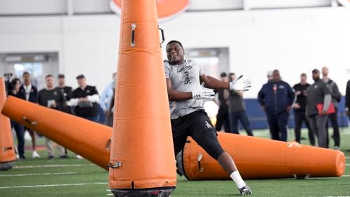 Defensive end Marlon Davidson works out during Auburn NCAA college football Pro Day Friday, March 6, 2020, in Auburn, Ala. (AP Photo/Julie Bennett)