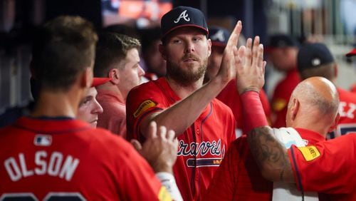 Braves starting pitcher Chris Sale greets teammates in the dugout after pitching through the seventh inning against the Tampa Bay Rays at Truist Park, Friday, June 14, 2024, in Atlanta. (Jason Getz / AJC)