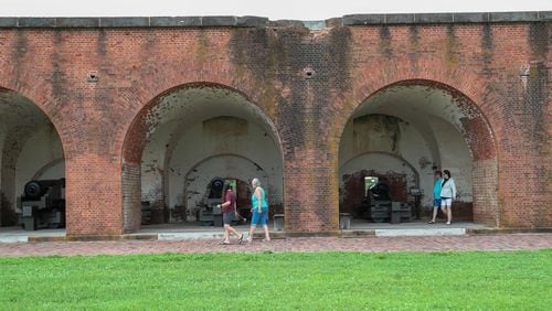 Visitors walk around cannon at Fort Pulaski National Monument. (Photo Courtesy of Richard Burkhart/Savannah Morning News)
