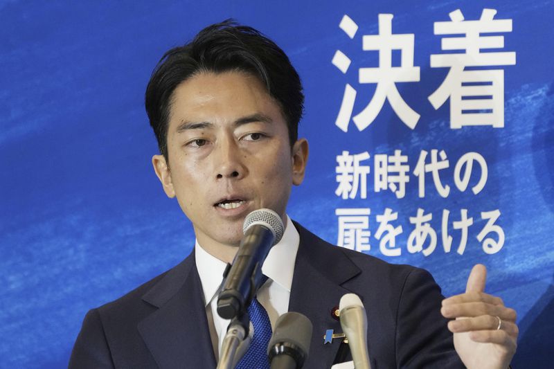 Japan's former Environment Minister Shinjiro Koizumi speaks at a news conference on running in the upcoming leadership election of the ruling Liberal Democratic Party in Tokyo, on Sept. 6, 2024. (Kyodo News via AP)