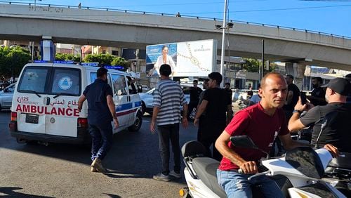 An ambulance carries wounded people whose handheld pager exploded, in Beirut, Lebanon, Tuesday, Sept. 17, 2024. (AP Photo/Hassan Ammar)