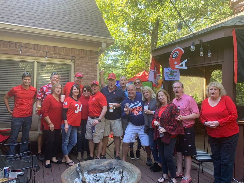 David and Betsy Lilliston of Watkinsville hosted fellow members of their "Take No Prisoners Tailgate" group in their backyard on Saturday. They were among a large number of donors to opt-out on season tickets this season. (Submitted photo)