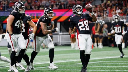 Falcons running back Carlos Washington Jr. (28) reacts after scoring a touchdown during the third quarter in a preseason game against the Cincinnati Bengals at Mercedes-Benz Stadium on Friday, Aug. 18, 2023, in Atlanta.
Miguel Martinezmiguel.martinezjimenez@ajc.com