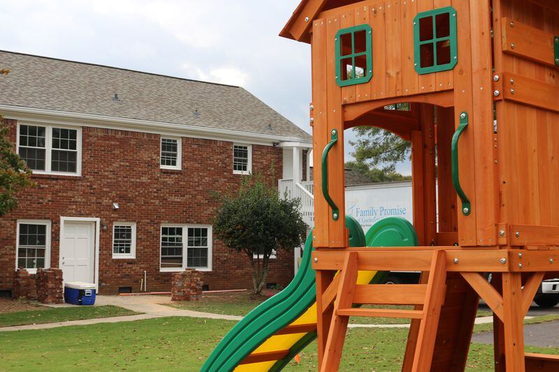 A small playset sits in the backyard of Promise Haven, a shelter for families in Lawrenceville renovated by Family Promise of Gwinnett County. Family Promise CEO Carol Love said two families will move in after the home opens on Nov. 5. William Newlin/For The Atlanta Journal-Constitution