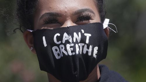 Tiana Day wears a mask that reads I Can’t Breathe before speaking in San Francisco June 6, 2020, at a protest over the Memorial Day death of George Floyd. AP PHOTO / JEFF CHIU