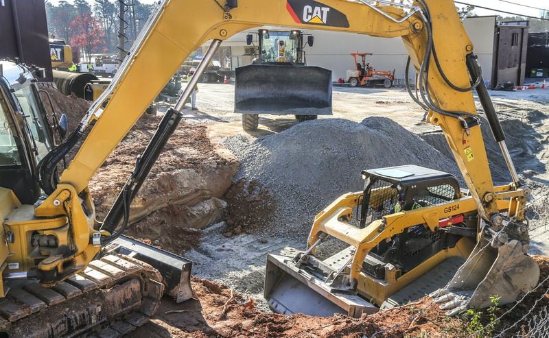 Repairs on the 48-inch water main pipe that broke off Buford Highway in March 2018. (JOHN SPINK / JSPINK@AJC.COM)