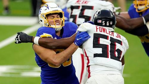 Los Angeles Chargers tight end Hunter Henry (left) works against Atlanta Falcons defensive end Dante Fowler Jr. (56) during the second half Sunday, Dec. 13, 2020, in Inglewood, Calif. (Ashley Landis/AP)