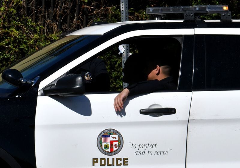 The Los Angeles Police Department’s iconic black-and-white patrol cars display the motto “To Protect and to Serve,” but decades of scandals and embarrassments have caused some residents to distrust the police. HYOSUB SHIN / Hyosub.Shin@ajc.com)