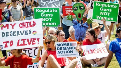 Gun safety measures are expected to be a hot topic in the next legislative session in Georgia. The photo was taken at a rally in Piedmont Park in May.