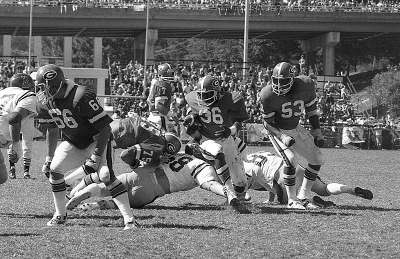 Georgia Bulldogs running back Willie McClendon (36) in action against Ole Miss on Oct. 7, 1978 at Sanford Stadium. Center Ray Donaldson (53) is among the lineman blocking for McClendon. (AJC file photo)