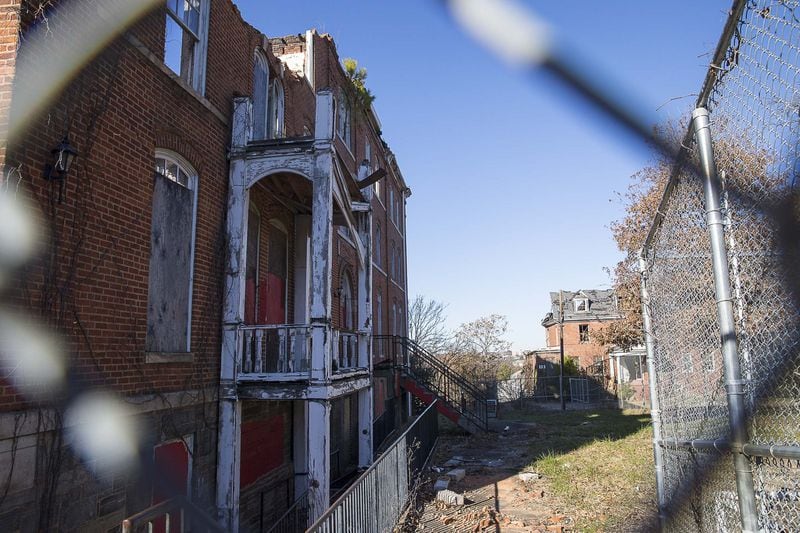 Gaines Hall, itself built in 1869, sits burned and gutted across from Fountain Hall on the campus of Morris Brown College. Another important building, Furber Cottage, built in 1899, burned down in September.  (ALYSSA POINTER/ALYSSA.POINTER@AJC.COM)