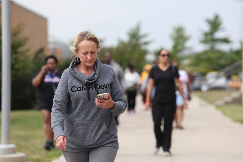 Family members of students at Northwest high school gather and wait for students to be released from the school after a shooting was reported Tuesday, Sept. 10, 2024, in Omaha, Neb. (Megan Nielsen/Omaha World-Herald via AP)