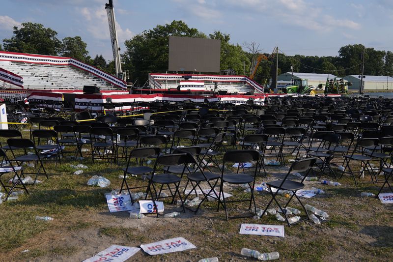 FILE - A campaign rally site for Republican presidential candidate former President Donald Trump is empty and littered with debris July 13, 2024, in Butler, Pa. (AP Photo/Evan Vucci, File)