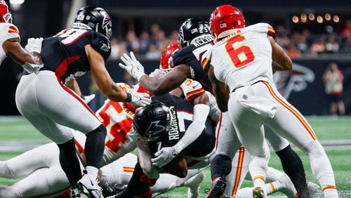 Atlanta Falcons running back Bijan Robinson (7) gets down in the fourth down by Kansas City. They got the ball back with one minute left in the game on Sunday, Sept. 22, 2024, at Mercedes-Benz Stadium in Atlanta. Kansas City Chiefs won 22-17.

(Miguel Martinez/ AJC)