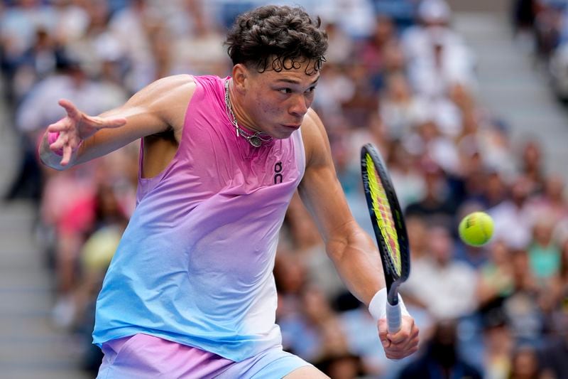 FILE - Ben Shelton returns a shot to Frances Tiafoe during the third round of the U.S. Open tennis championships, Aug. 30, 2024, in New York. (AP Photo/Seth Wenig, File)