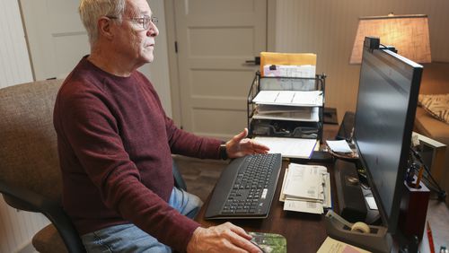 Allan Owen searches for remote part-time jobs on his computer at his home, Thursday, Jan. 26, 2023, in Lilburn, Ga.. Owen retired in 2014 as Director of Technical Services for the Gwinnett County Clerk of Court. He has considered getting a remote part-time job to help with their living expenses. Jason Getz / Jason.Getz@ajc.com)