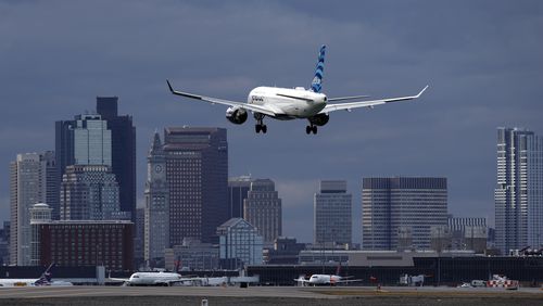 FILE - A JetBlue plane lands at Logan International Airport, Jan. 26, 2023, in Boston. JetBlue reports earnings on Tuesday, July 30, 2024. (AP Photo/Michael Dwyer, File)