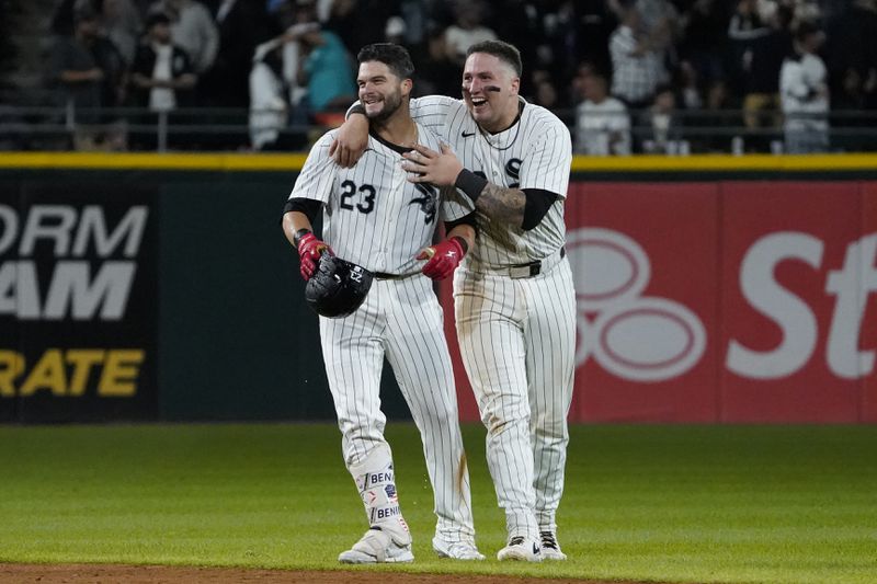 Chicago White Sox's Andrew Benintendi, left, celebrates his walk-off RBI single with catcher Korey Lee, right, against the Los Angeles Angels during the tenth inning of a baseball game, Wednesday, Sept. 25, 2024, in Chicago. (AP Photo/David Banks)