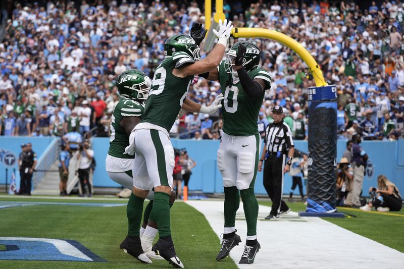 New York Jets running back Braelon Allen (0) celebrates scoreing a touchdown with teammate New York Jets tight end Jeremy Ruckert (89) in the second half of an NFL football game in Nashville, Tenn., on Sunday, Sept. 15, 2024. (AP Photo/George Walker IV)