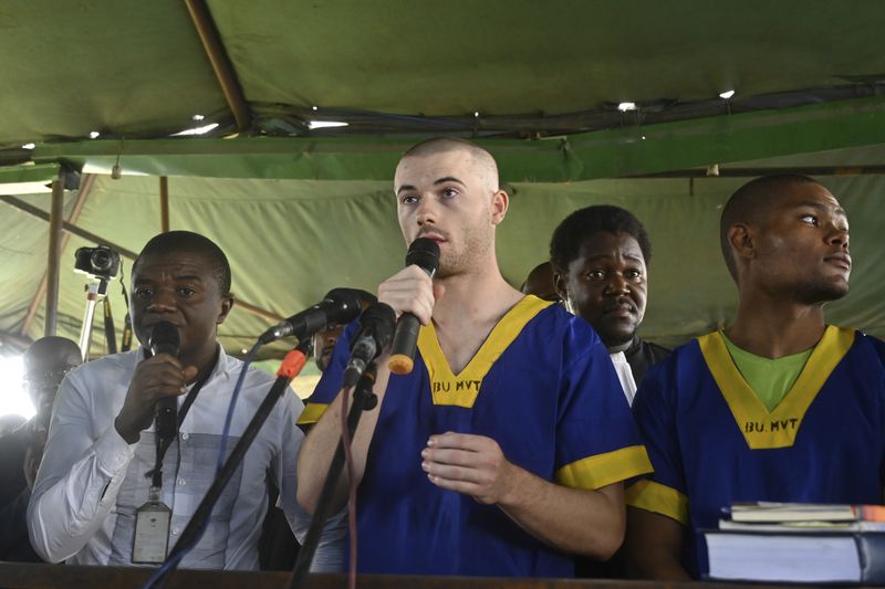 Tyler Thompson Jr, adresses the court in Kinshasa with 52 other defendants Friday June 7, 2024, accused of a role in last month's attempted coup in Congo, led by little-known opposition figure Christian Malanga, in which six people were killed. (AP Photo/Samy Ntumba Shambuyi)