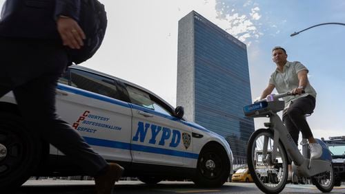 A NYPD patrol car parks across the street from the United Nations Headquarters, Saturday Sept. 21, 2024. (AP Photo/Stefan Jeremiah)