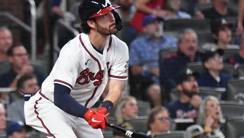 Braves shortstop Dansby Swanson (7) hits an RBI triple to score Atlanta Braves catcher Travis d'Arnaud (16) in the 4th inning Thursday, Sept. 30, 2021, at Truist Park in Atlanta. (Hyosub Shin / Hyosub.Shin@ajc.com)