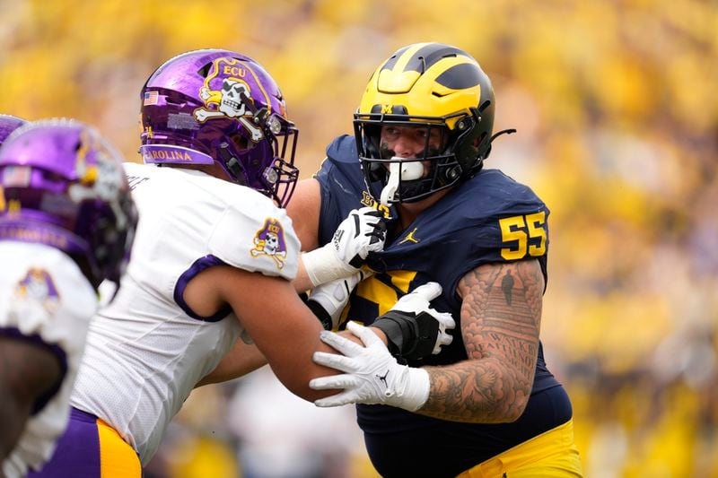 FILE - Michigan defensive lineman Mason Graham (55) rushes against East Carolina in the second half of an NCAA college football game in Ann Arbor, Mich., Saturday, Sept. 2, 2023. (AP Photo/Paul Sancya, File)