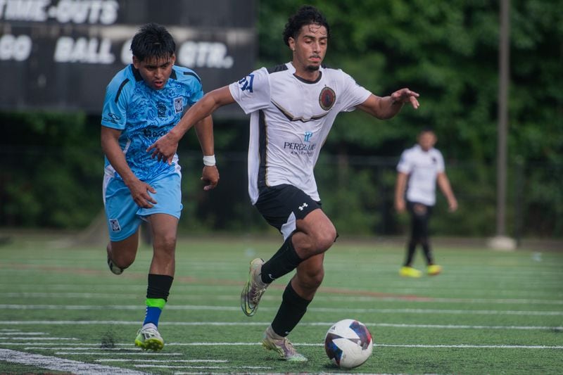 Ethan Ruiz attempts to pass the ball to his teammates in a soccer game at Bethesda Park in Lawrenceville on Sunday, Aug. 4, 2024.  (Ziyu Julian Zhu / AJC)