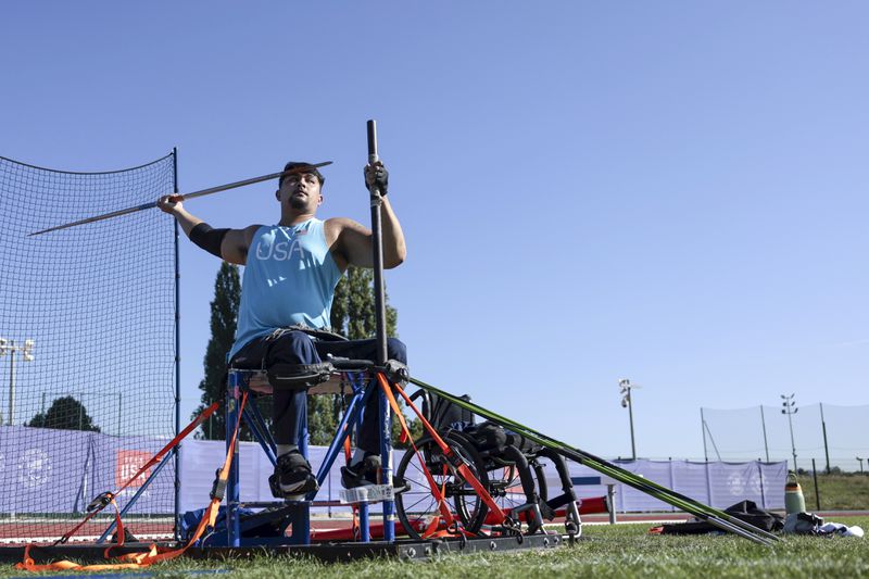 Justin Phongsavanh from the U.S. throws his javelin during a media tour of the U.S. team at the High Performance Center during the Paralympic Games in Paris on Wednesday, August 28, 2024. Team USA kept their facility open after the conclusion of the Olympic Games. (AP Photo/Mady Mertens)