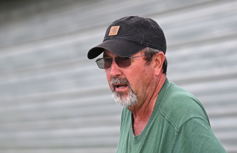 Doug Harper shows damaged generator pieces caused by Hurricane Helene outside his chicken houses, Tuesday, October 1, 2024, in Nashville, Ga. Harper lost his chickens after his property lost power. (Hyosub Shin / AJC)