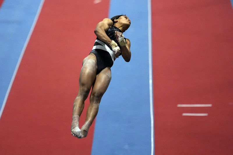 FILE - Gabby Douglas competes on the vault at the American Classic Saturday, April 27, 2024, in Katy, Texas. (AP Photo/David J. Phillip, File)