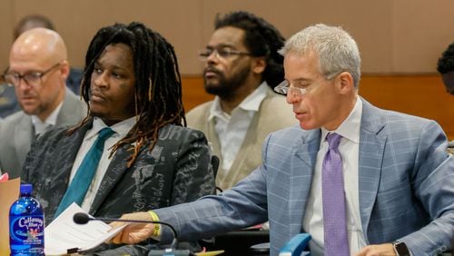 Atlanta rapper Young Thug, whose real name is Jeffery Williams, listens to Judge Peige Resse Withaker as his defense attorney, Brian Steel, goes through documents during a motion hearing at the Fulton County Courtroom on Tuesday, July 30, 2024.

(Miguel Martinez / AJC)