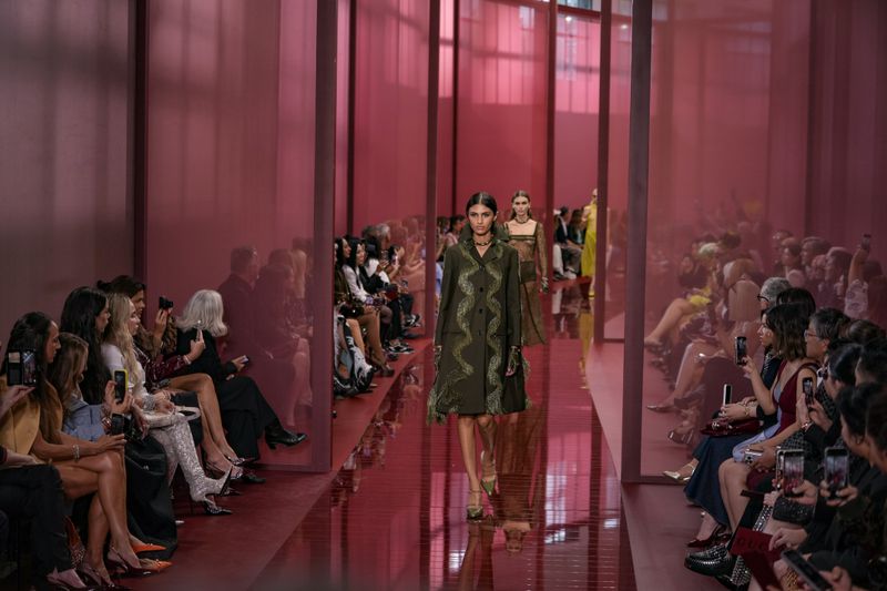 A model wears a creation as part of the Gucci Spring Summer 2025 collection, that was presented in Milan, Italy, Friday, Sept. 20, 2024. (AP Photo/Luca Bruno).