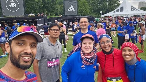 At last year’s Peachtree Road Race, members of the Atlanta Muslim Running Club met up after the race to celebrate. Left to right: Club founder Arif Kazi, Mohammad Khalid Akhtar, Ahmed Khan, Laila Kashlan, Yousra Mohamoud, and Karima Ahmed. The women’s combination of hijabs and patriotic colors got a lot of positive comments from many at the race. (Courtesy of Yousra Mohamoud)