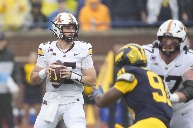 Minnesota quarterback Max Brosmer (16) looks to pass during the first half of an NCAA college football game against Michigan, Saturday, Sept. 28, 2024, in Ann Arbor, Mich. (AP Photo/Carlos Osorio)