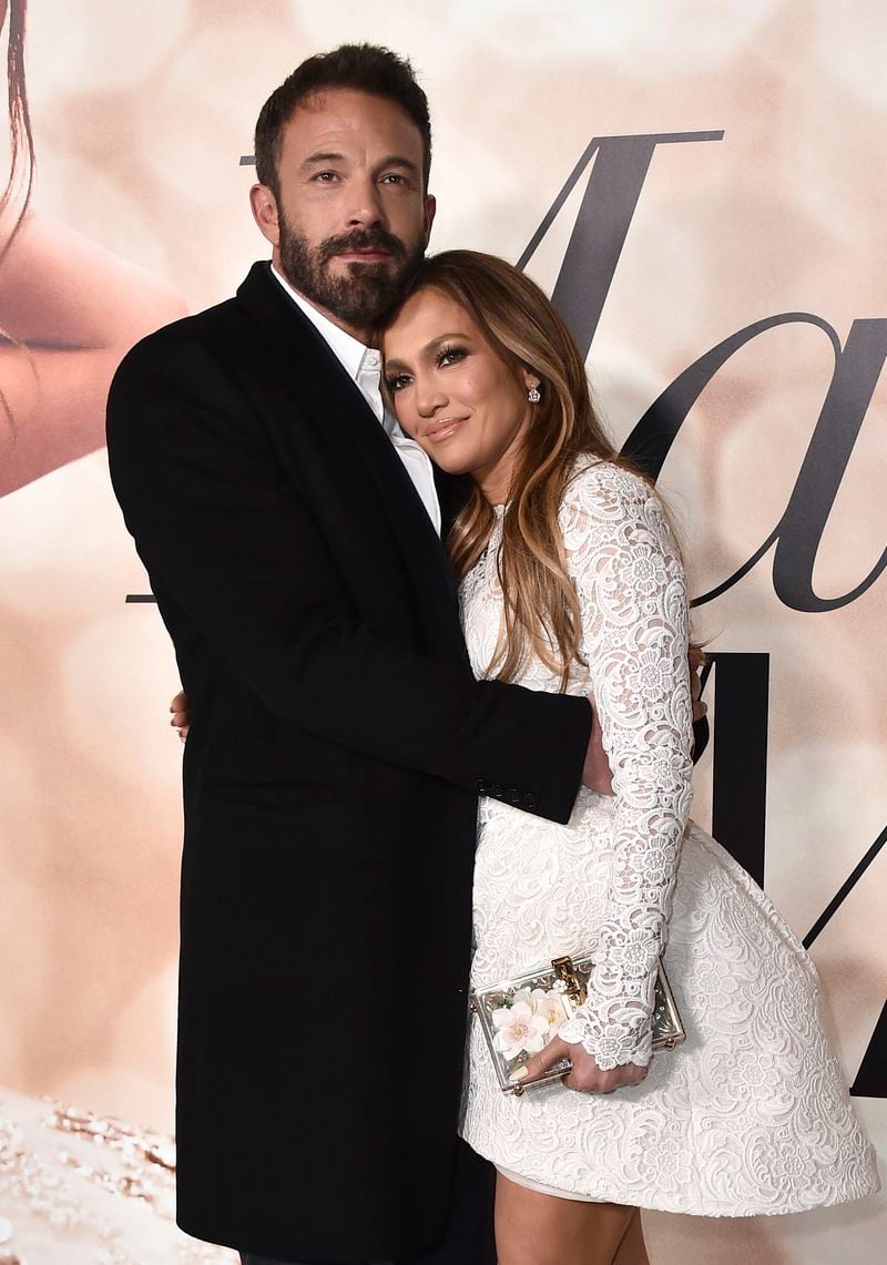 FILE - Cast member Jennifer Lopez, right, and Ben Affleck attend a photo call for a special screening of "Marry Me" on Feb. 8, 2022, in Los Angeles. (Photo by Jordan Strauss/Invision/AP, File)