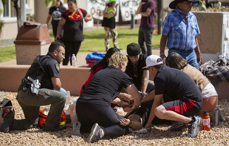 FILE - Activists tend to a shooting victim during a protest where officials had planned to install a statue of Spanish conquistador Juan de Oñate Thursday, Sept. 28, 2023, in Española, N.M. (Luis Sanchez Saturno/Santa Fe New Mexican via AP, File)