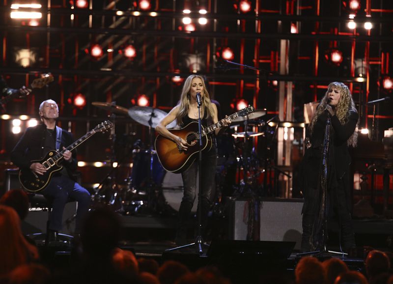 FILE - Peter Frampton, from left, Sheryl Crow, and Stevie Nicks perform during the Rock & Roll Hall of Fame Induction Ceremony in New York on Nov. 3, 2023. (Photo by Andy Kropa/Invision/AP, File)