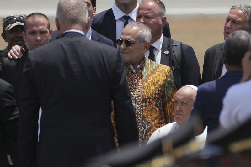 Pope Francis is accompanied by East Timor's President Jose Ramos-Horta to abroad a plane to Singapore at Nicolau Lobato International Airport in Dili, East Timor, Wednesday, Sept. 11, 2024. (AP Photo/Dita Alangkara)