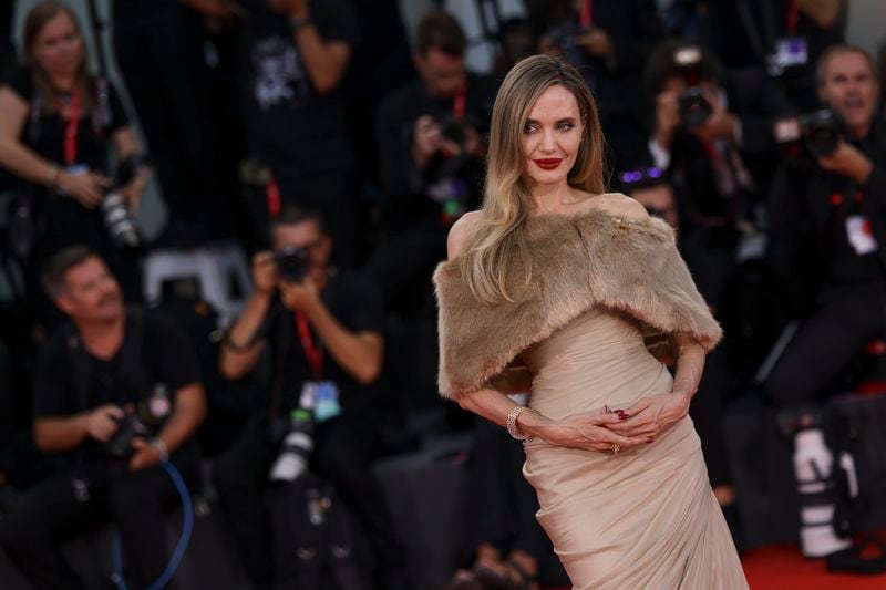 Angelina Jolie poses for photographers upon arrival for the premiere of the film 'Maria' during the 81st edition of the Venice Film Festival in Venice, Italy, on Thursday, Aug. 29, 2024. (Photo by Vianney Le Caer/Invision/AP)