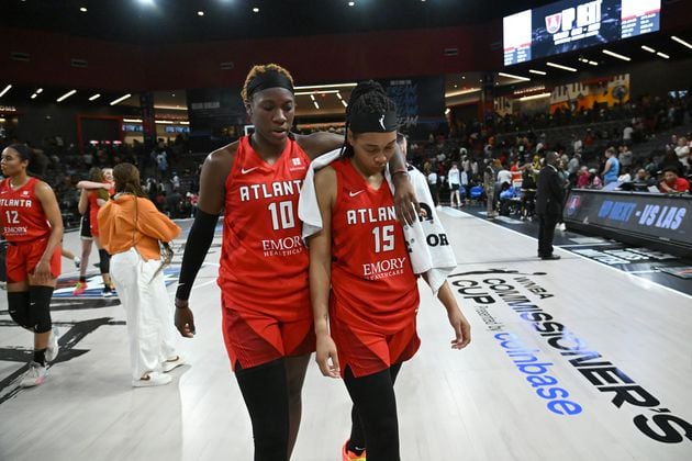 Atlanta Dream guard Rhyne Howard (10) and guard Allisha Gray (15) walk off the court after falling 87-68 to the Washington Mystics at the Gateway Center Arena on Tuesday night. (Hyosub Shin / AJC)