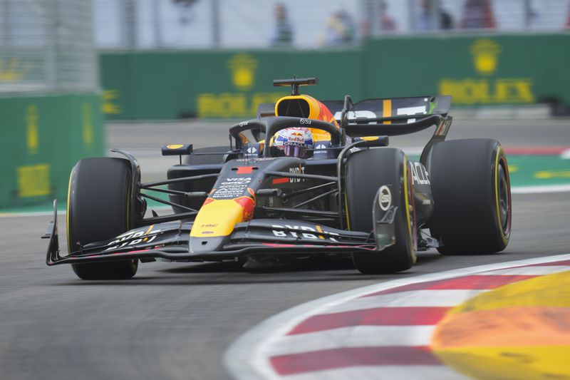 Red Bull driver Max Verstappen of the Netherlands steers his car during the first practice session of the Singapore Formula One Grand Prix at the Marina Bay Street Circuit, in Singapore, Friday, Sept. 20, 2024. (AP Photo/Vincent Thian)