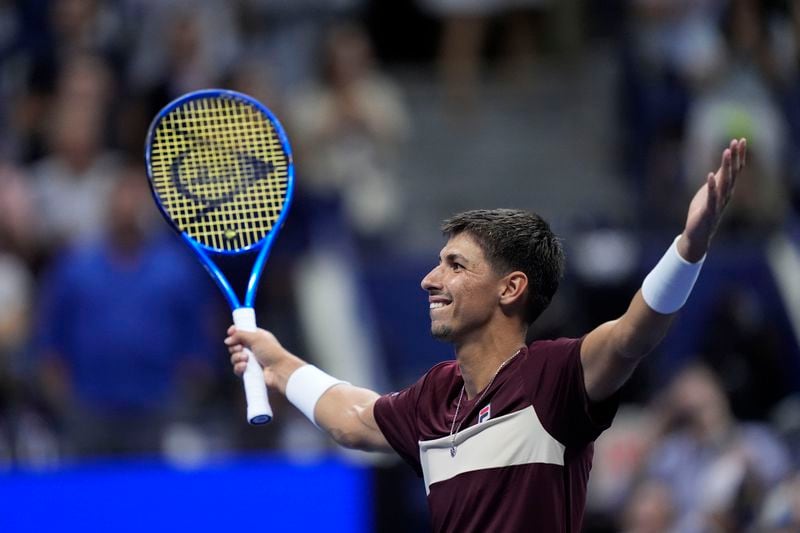 Alexei Popyrin, of Australia, reacts Novak Djokovic, of Serbia,during a third round match of the U.S. Open tennis championships, Friday, Aug. 30, 2024, in New York. (AP Photo/Julia Nikhinson)