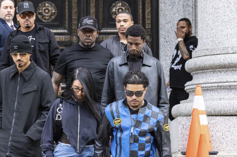 FILE - Sean "Diddy" Combs' sons Quincy Brown, left, Justin Dior Combs, right, King Combs, center, leave Manhattan federal court in New York, Sept. 18 2024. (AP Photo/Stefan Jeremiah, File)