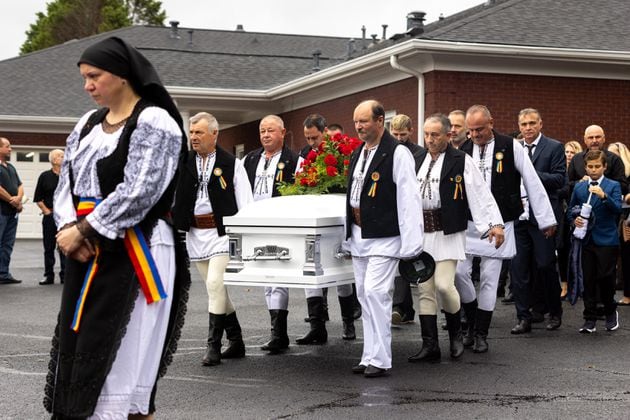 Mourners carry the casket of Ana Cristina Irimie, a math teacher killed at Apalachee High School during a school shooting, after her funeral service at Hamilton Mill Memorial Chapel and Gardens in Buford on Saturday, September 14, 2024. (Arvin Temkar / AJC)