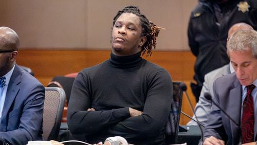 Young Thug, whose real name is Jeffery Williams, listens to Fulton County Chief Judge Ural Glanville as he tells the court his trial is on hold until next year after one of the defendants was stabbed over the weekend while in Jail. (Steve Schaefer/steve.schaefer@ajc.com)