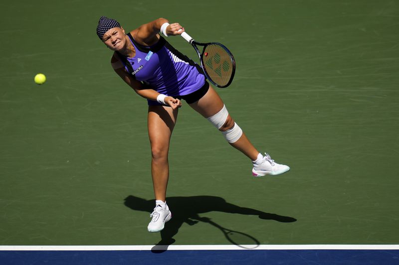 Daria Snigur, of Ukraine, serves during a match against Jessica Pegula, of the United States, in the fourth round of the U.S. Open tennis championships, Monday, Sept. 2, 2024, in New York. (AP Photo/Kirsty Wigglesworth)