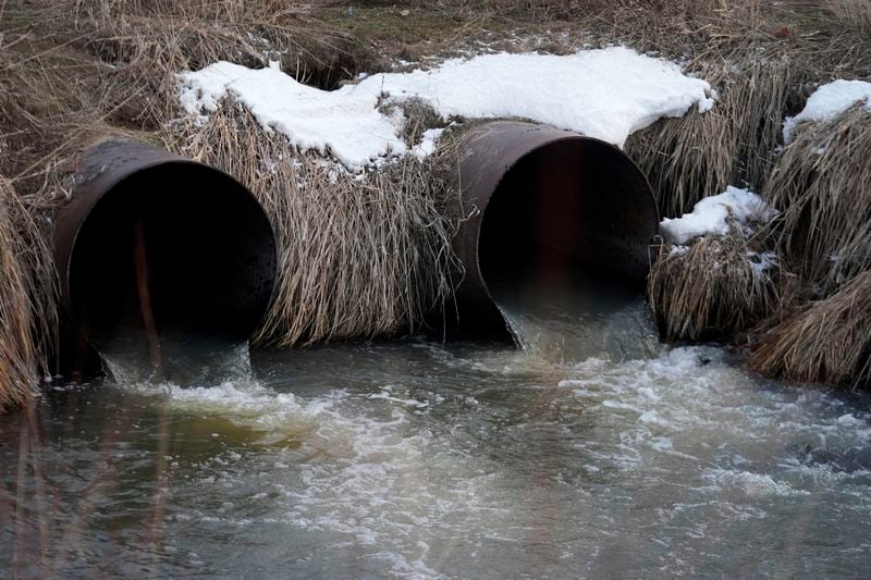 Water flows through a culvert at an irrigation canal on the Duck Valley Indian Reservation, March 13, 2024, in Owyhee, Nev. (AP Photo/Rick Bowmer)