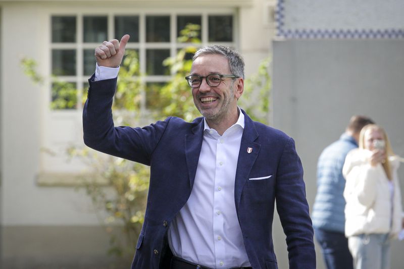 Herbert Kickl, leader of the Freedom Party of Austria gives a thumbs-up as he arrives at a polling station in Purkersdorf, Austria, Sunday, Sept. 29, 2024, to cast his vote in the country's national election. (AP Photo/Heinz-Peter Bader)